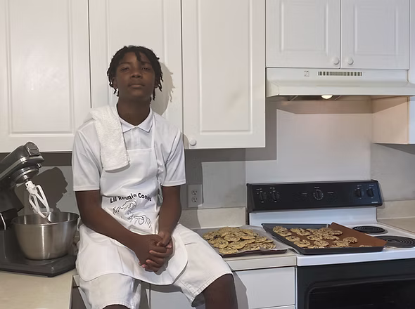 Lil Reggie with his first mixer while developing cookies