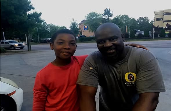 Lil Reggie when he was younger helping a homeless man